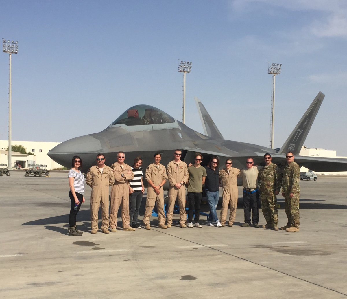 The band Soul Asylum poses with Service members during their USO tour. Photo by Jeneen Anderson